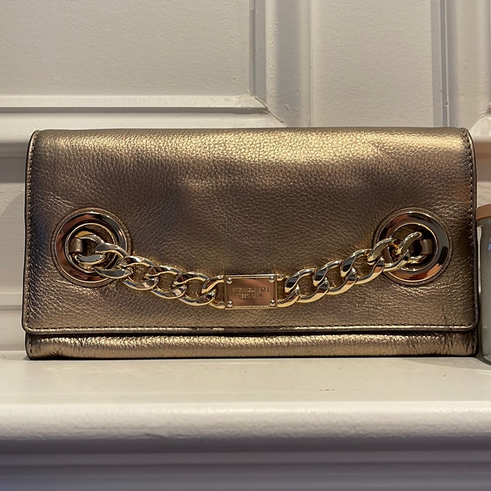 Gold Michael Kors clutch.